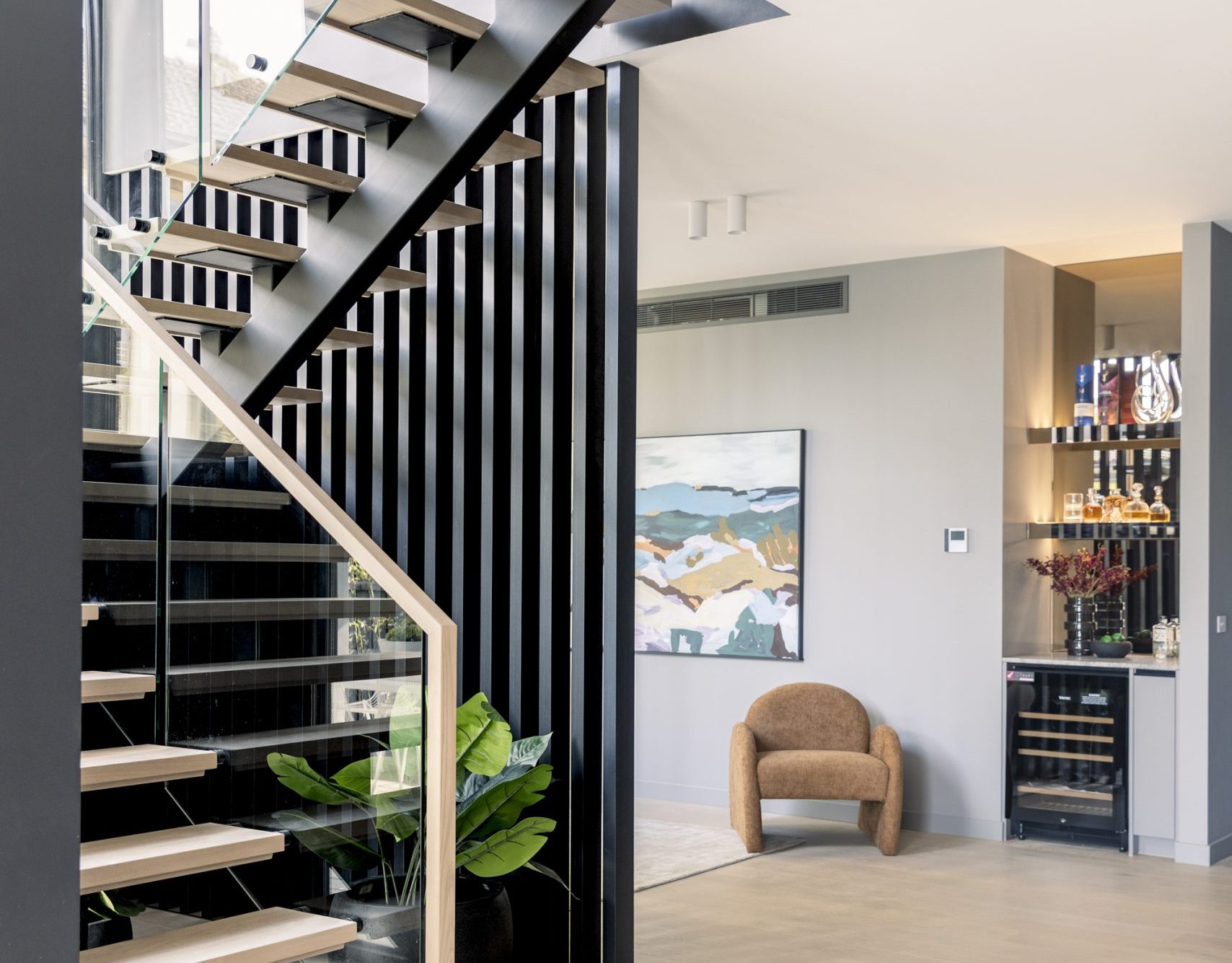Floating timber staircase with black steel balustrade, Scheele Residence Surrey Hills