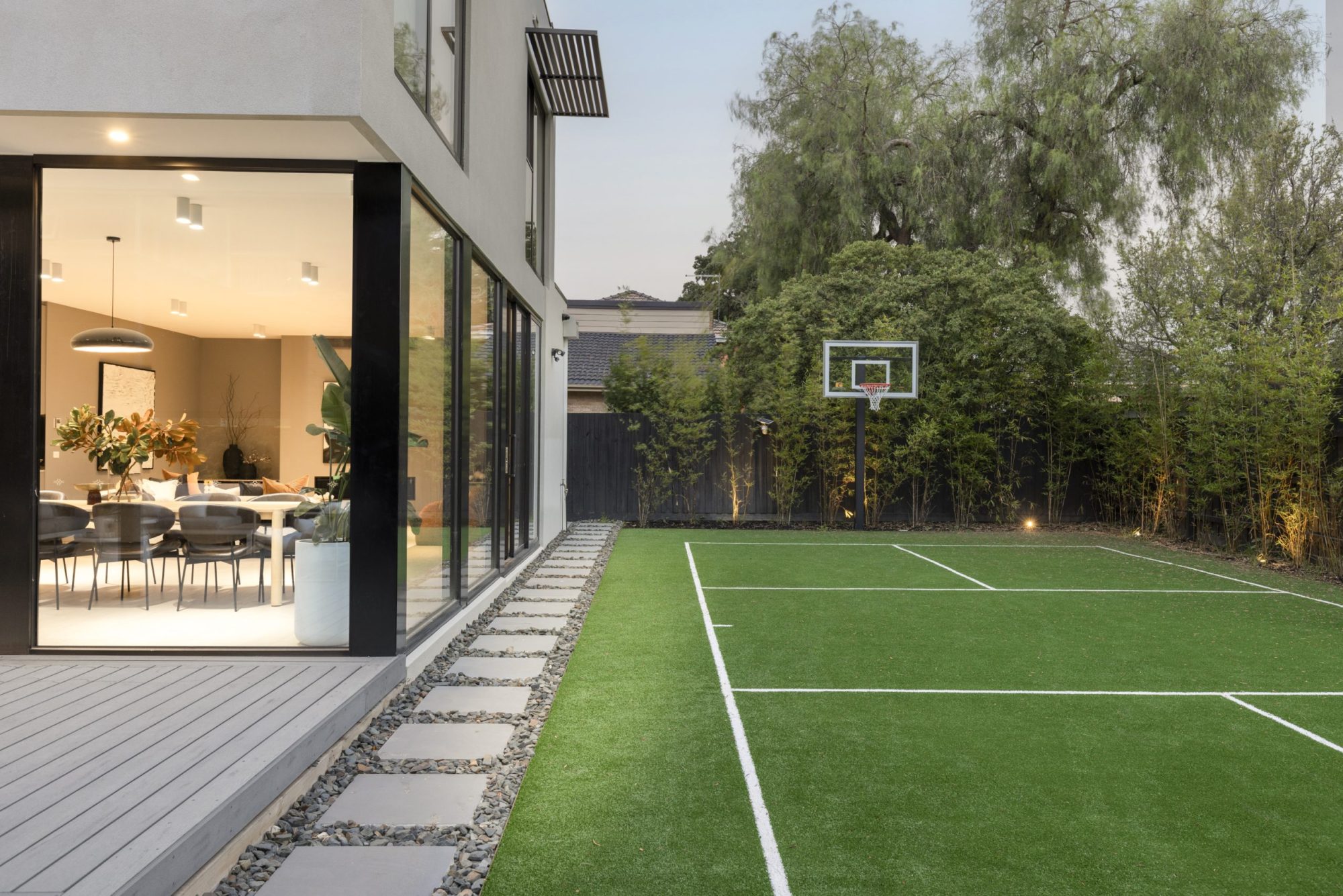 Backyard lawn and sports court, Surrey Hills knockdown rebuild by Bluestar